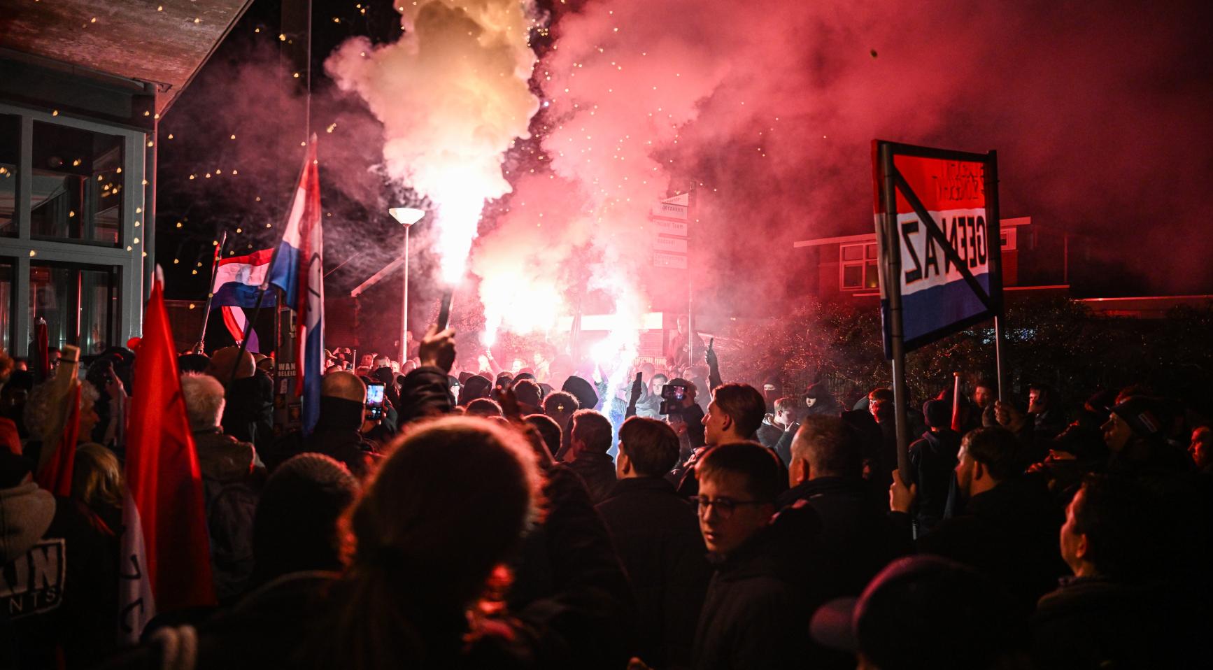 Protesters throw stones and glass at police during anti-asylum demonstration in Bleskensgraaf