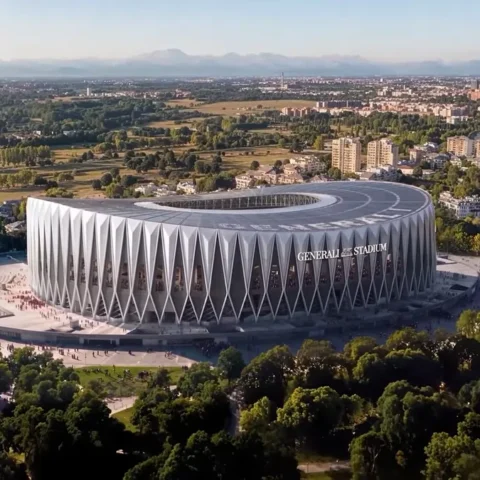 Luchtbeeld van een modern stadionontwerp met de naam Generali Stadium, omringd door groen en bebouwing.