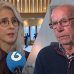 Mona Keijzer spreekt in een interview, naast een oudere man in beeld.