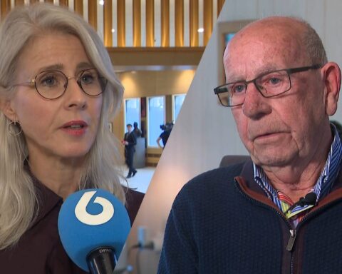 Mona Keijzer spreekt in een interview, naast een oudere man in beeld.