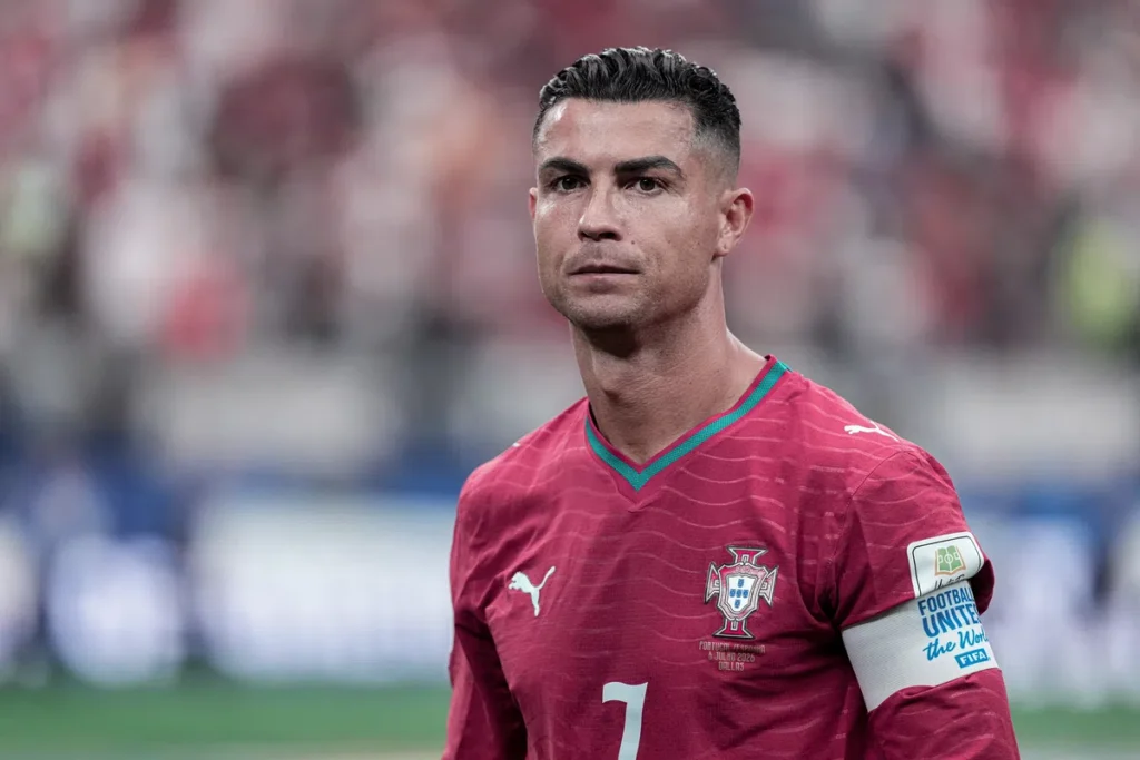 Cristiano Ronaldo wearing a Portugal football jersey during a match.