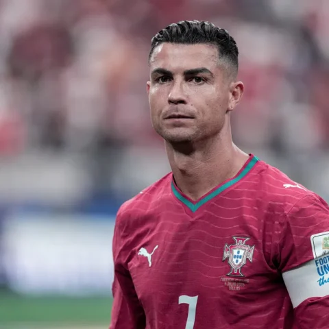 Cristiano Ronaldo wearing a Portugal football jersey during a match.