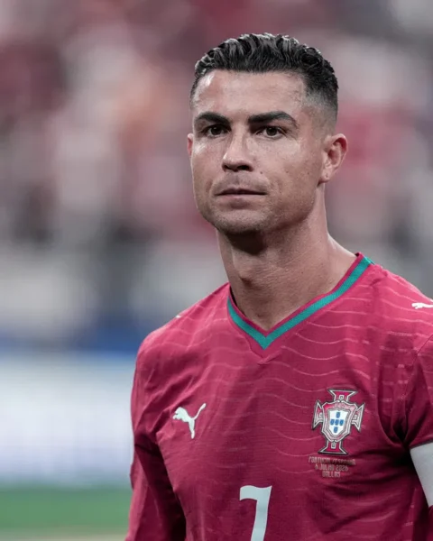 Cristiano Ronaldo wearing a Portugal football jersey during a match.